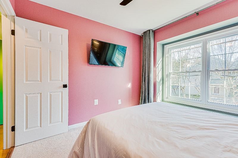Our Unique "Mauve" Room, w/ a Full sized bed w/ Helix Midnight Mattress, hospitality grade sheets, and a 42" Smart TV