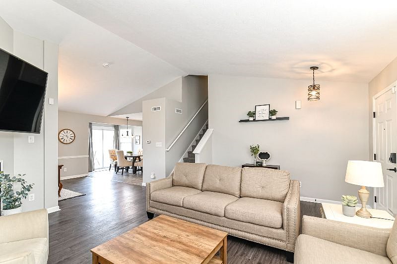 Living room with gas fireplace and large smart TV