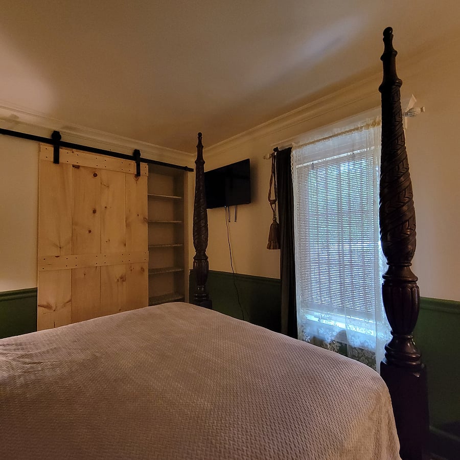 Queen bed includes a tv.