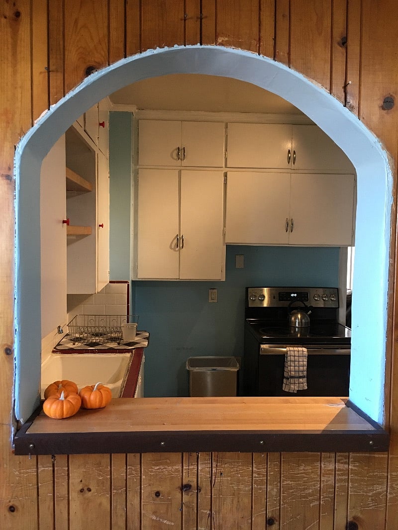 View of the kitchen through the arch from the dining room.