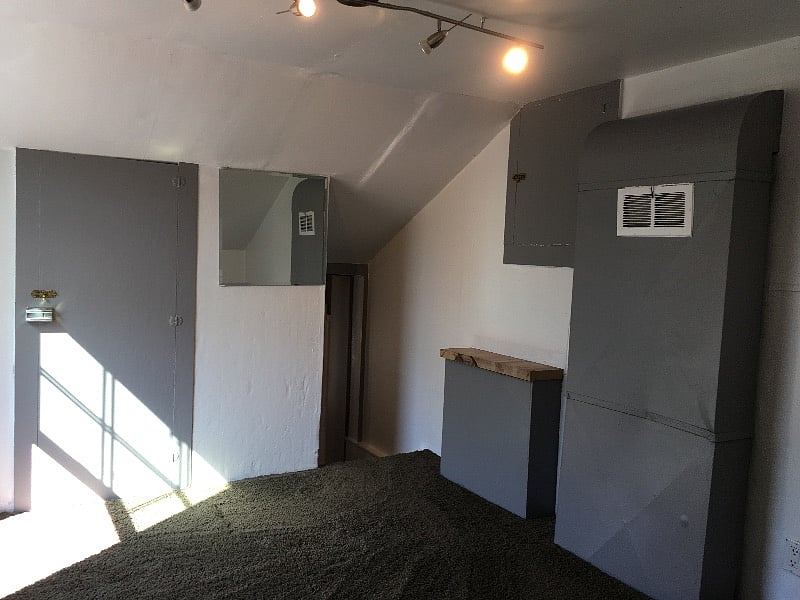 The lofted room from the other side of the room.