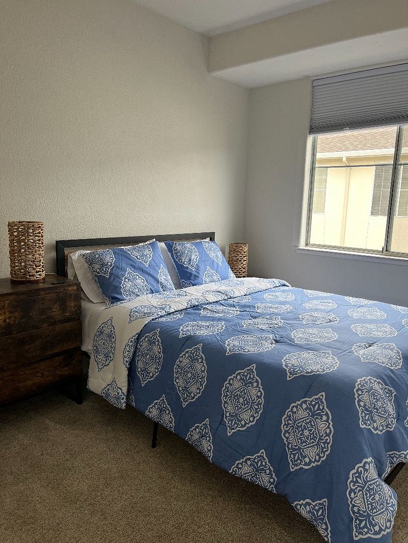 2nd bedroom with Queen bed and blackout shades