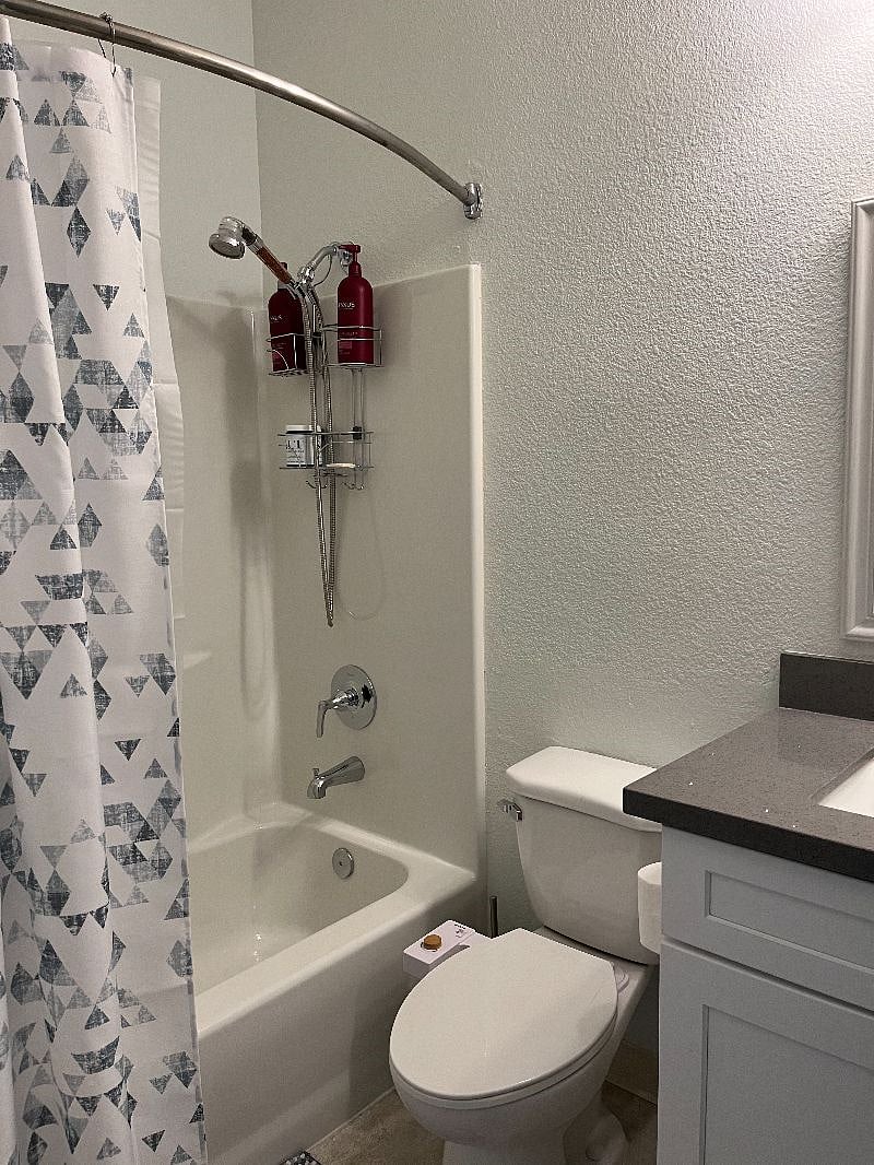 Hall bathroom with shower and tub