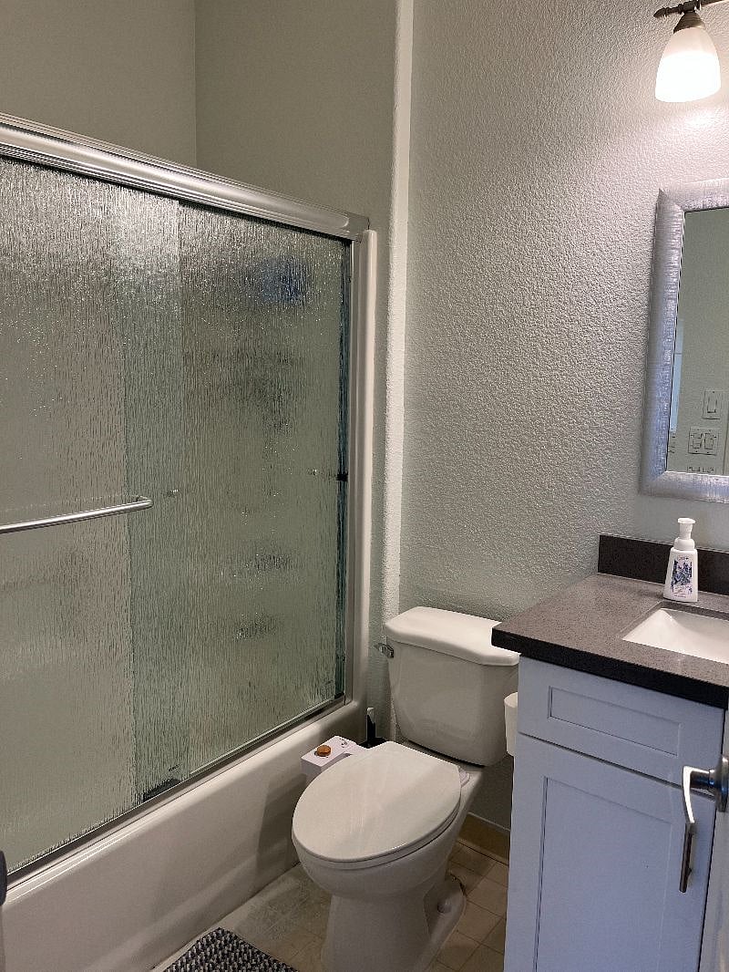 Remodeled ensuite master bathroom with shower and tub