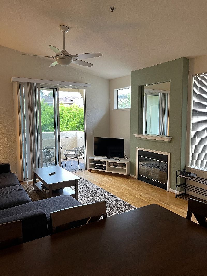 Living room with streaming TV. 2nd floor balcony overlooks pool.