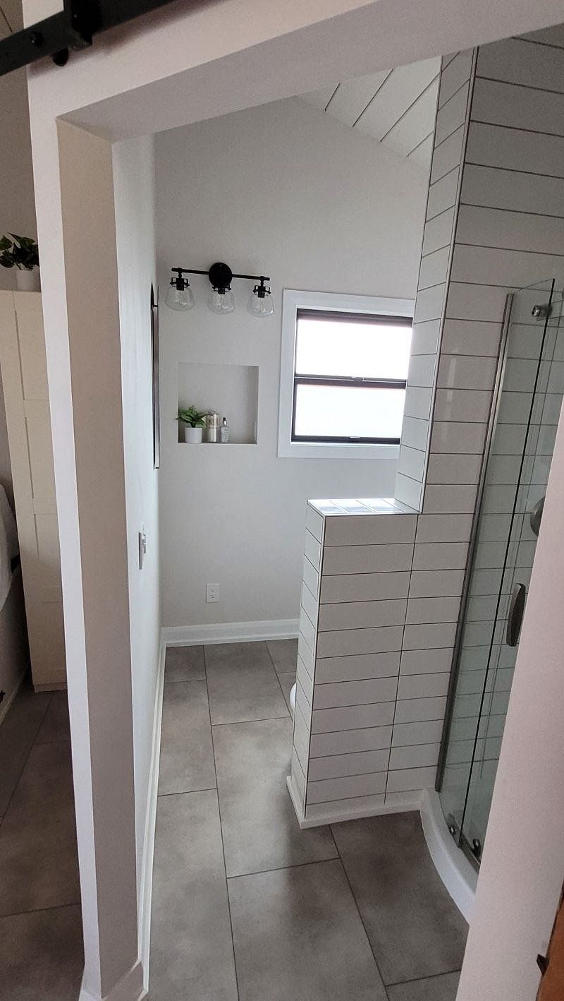 BEST natural light, bathroom window looks out on personal patio.