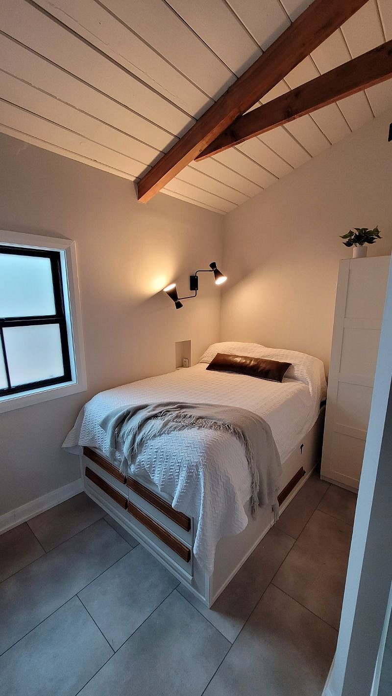 4 dresser drawers, and under-bed access for storage bins with additional linens, luggage, etc