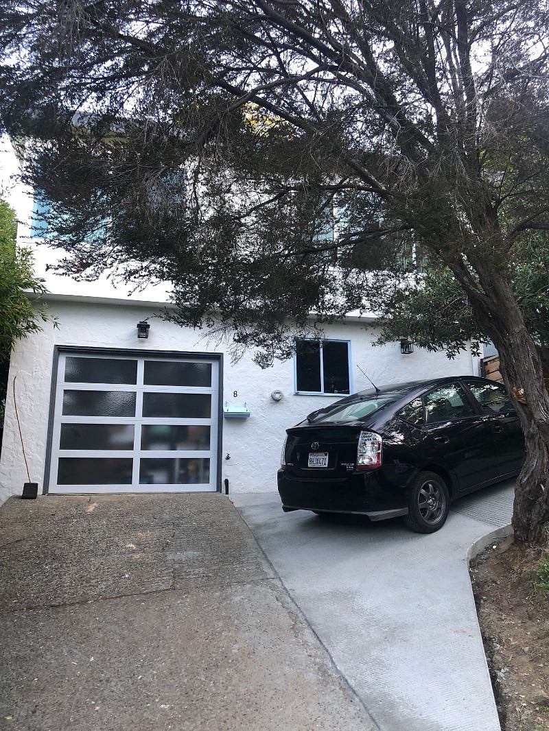 Front view of house with parking in either driveway or on street.