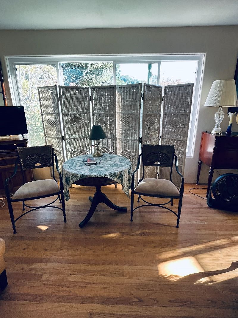 Livingroom front window set of table and chairs.