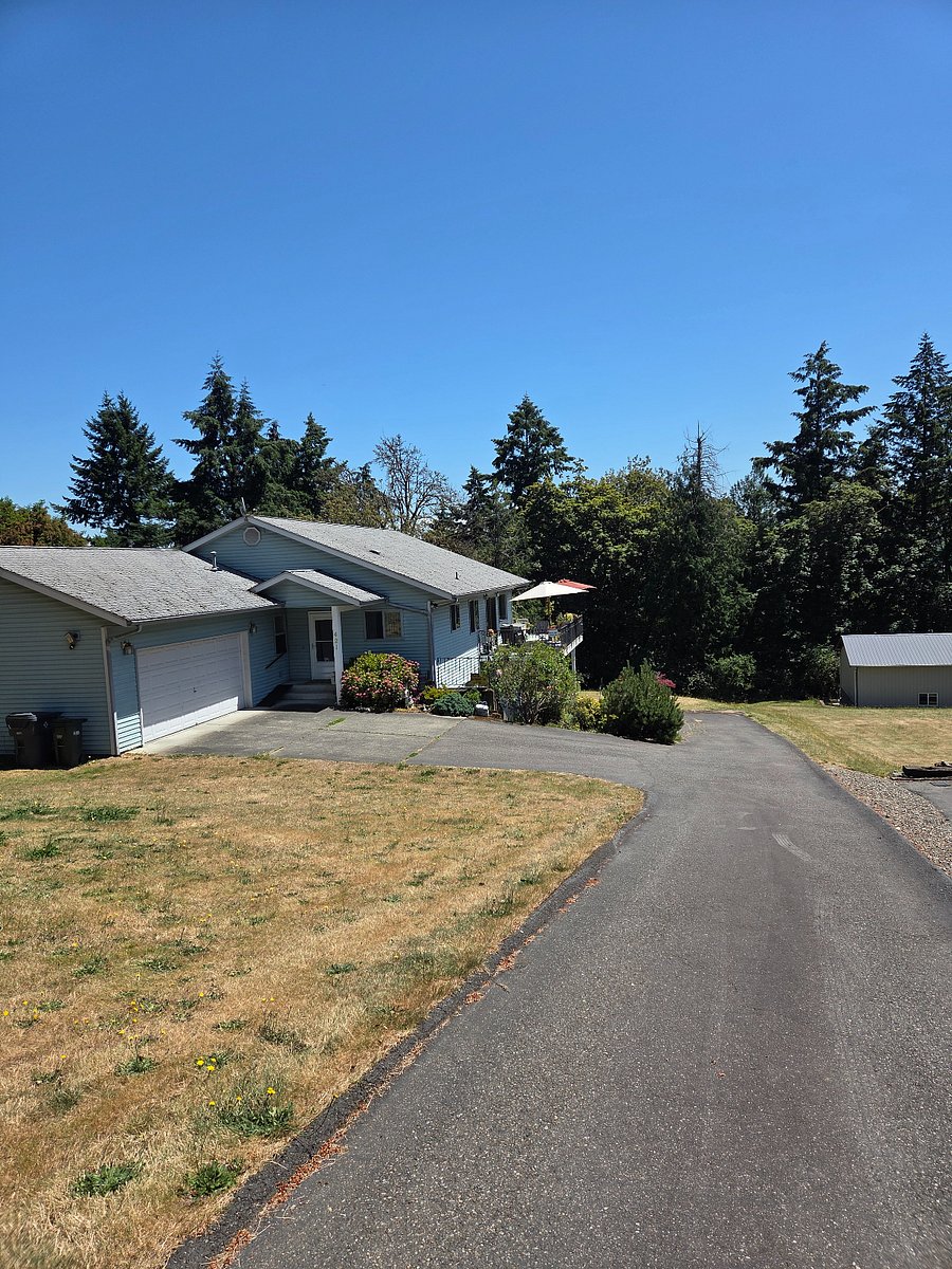 View of house from the top of the driveway. '26
