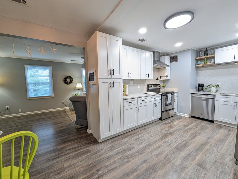 The kitchen has been recently renovated with modern amenities, stainless appliances and a dishwasher