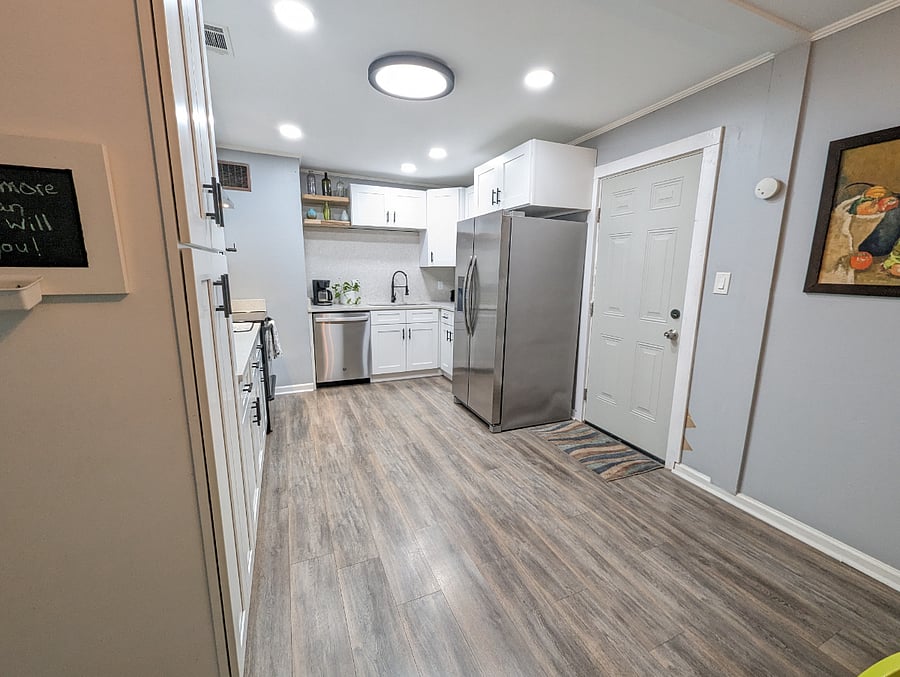 The kitchen has been recently renovated with modern amenities, stainless appliances and a dishwasher