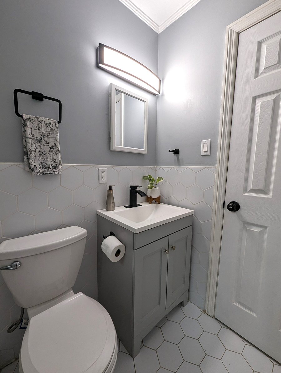 Newly renovated bath with custom tile and rainfall shower.
