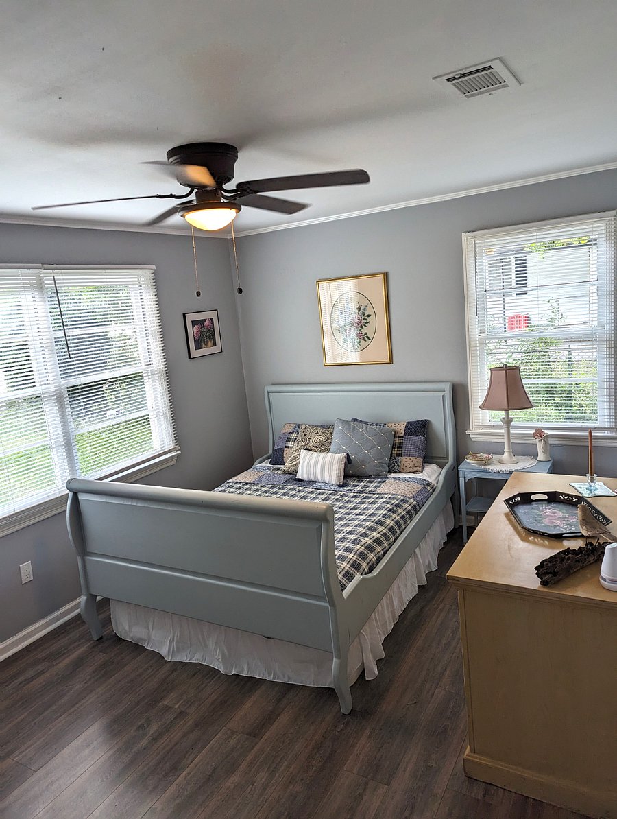 Bedroom 2 is warm and cozy. Queen bed, original art and a closet.