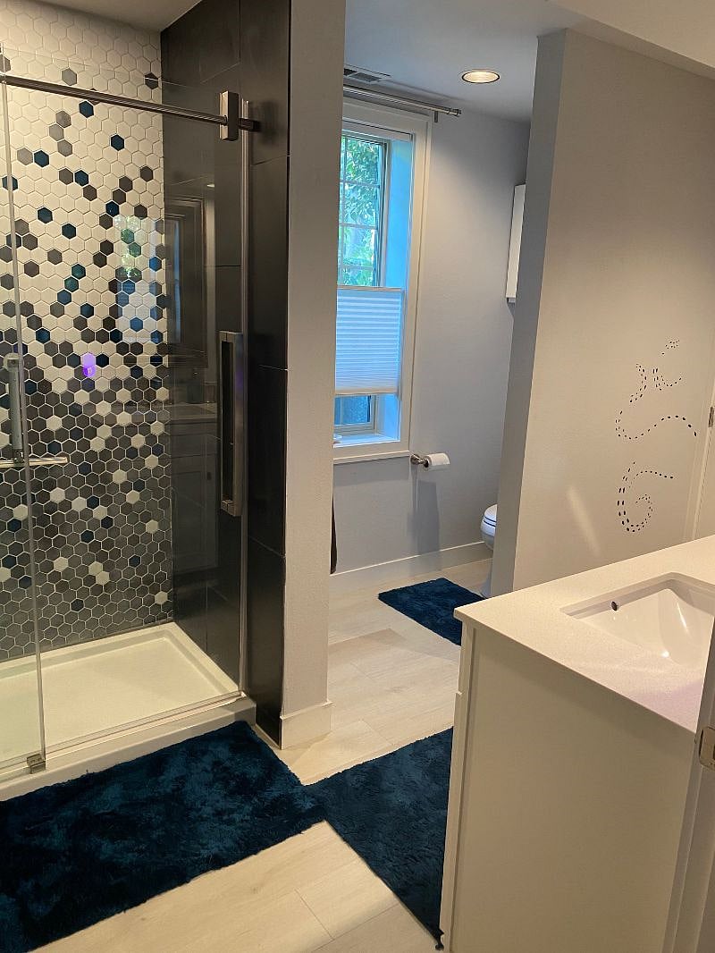 Full size master en-suite bathroom with shower, closet and double vanity