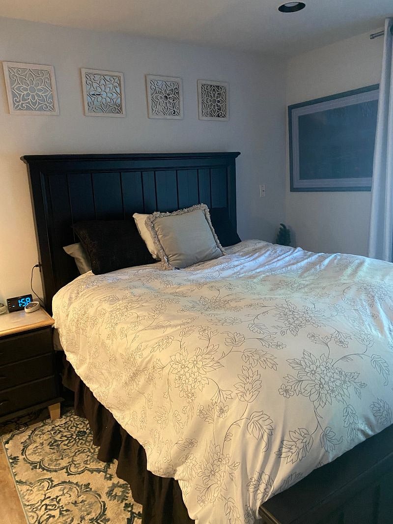 Queen bed with Sealy Black Label high end mattress; down comforter bedding and high quality sheets/pillows included (or bring your own if you wish) two night stands with clock and headboard has (2) USB charging pots on each side