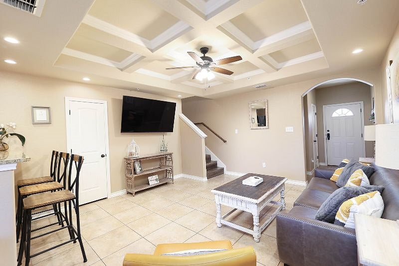 Relax on your comfy couch and enjoy your 65" smart tv