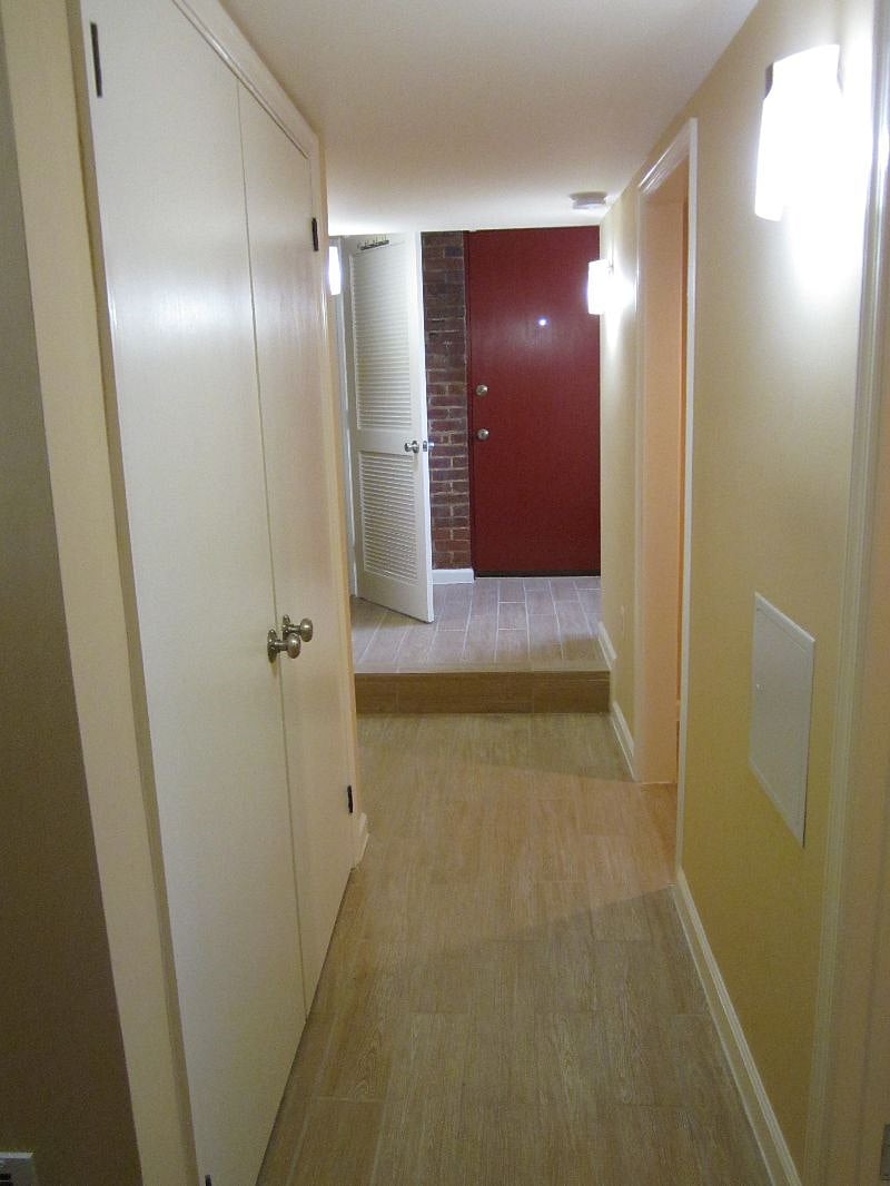 Front/main hallway leads to the bathroom, bedroom, kitchen & living areas.
