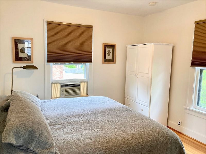 First bedroom with a king size bed and large wardrobe. 