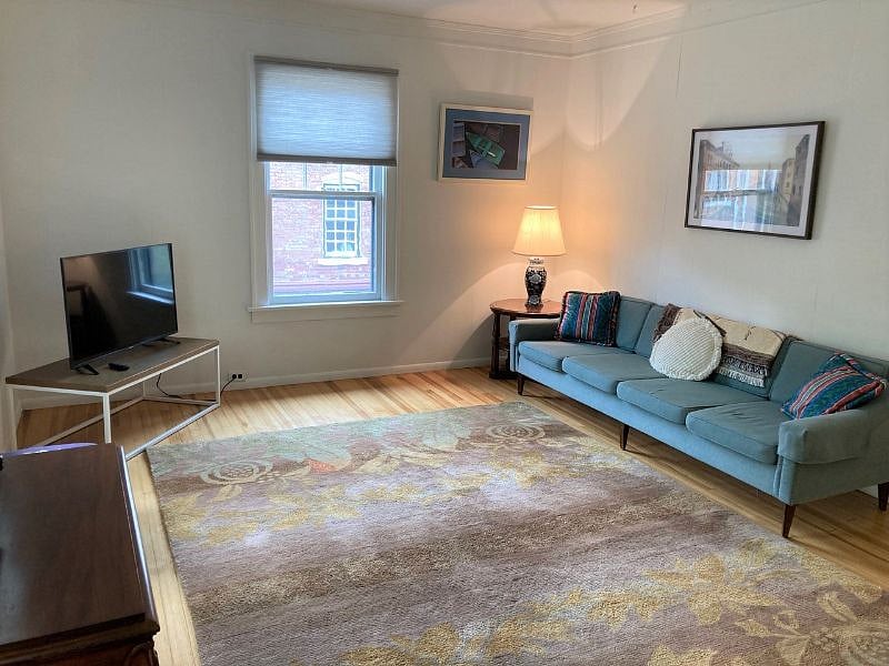 Large couch and tv in the main living room.  Streaming apps available through provided Wifi. 