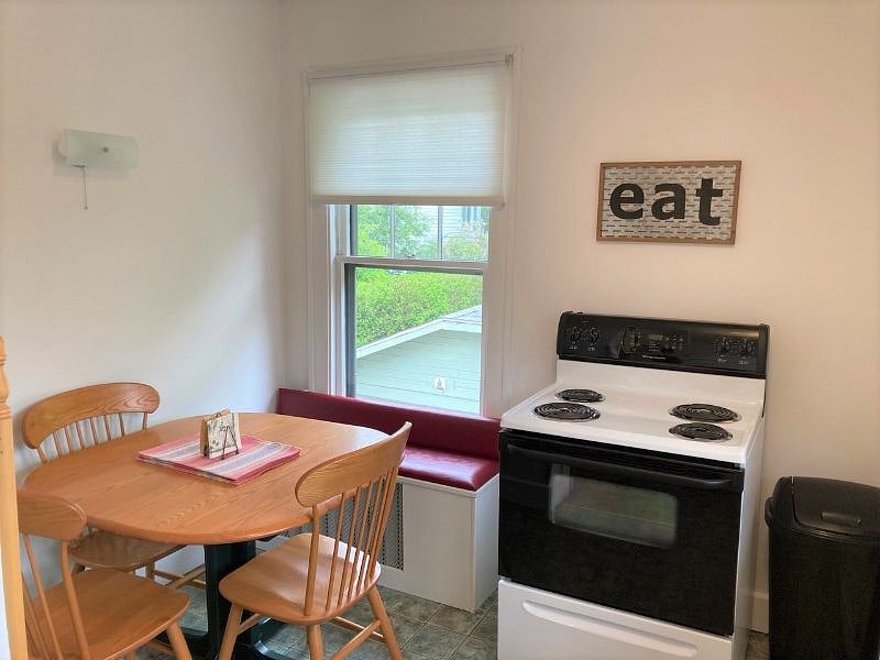 Kitchen photo number 3 with table and chairs.