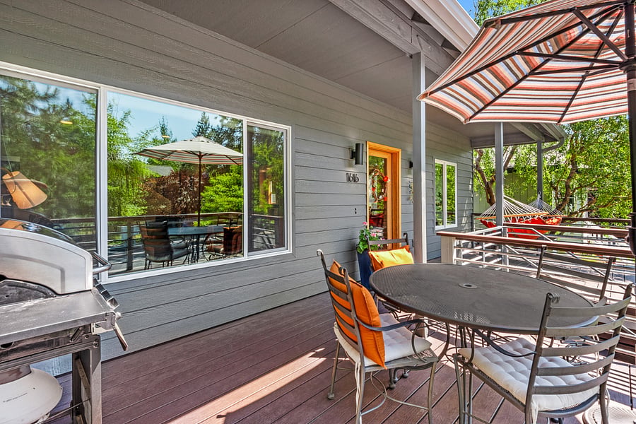 Front deck features grill, outdoor dining for 4 (feel free to bring out more chairs!) and hammock. Umbrella & big curly willow tree provides shade.