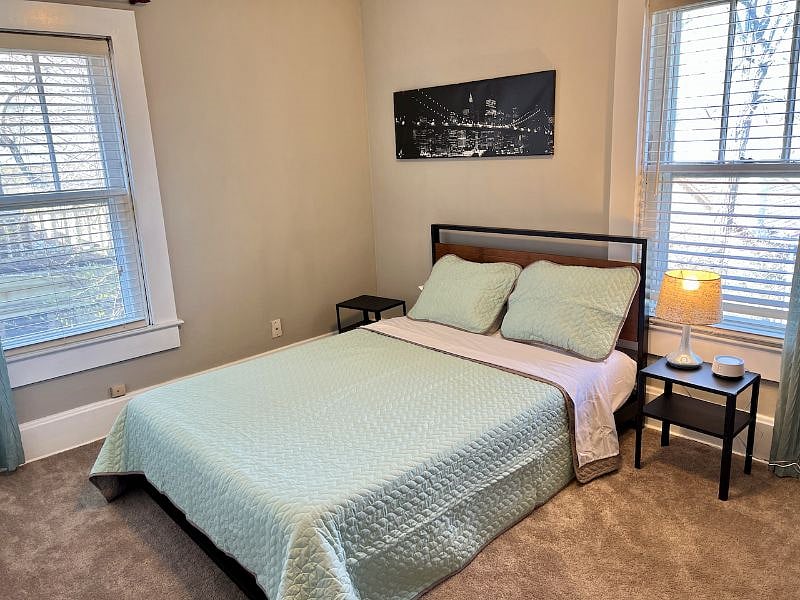 Upstairs. Guest bedroom. Full size bed with foam mattress. New York Theme