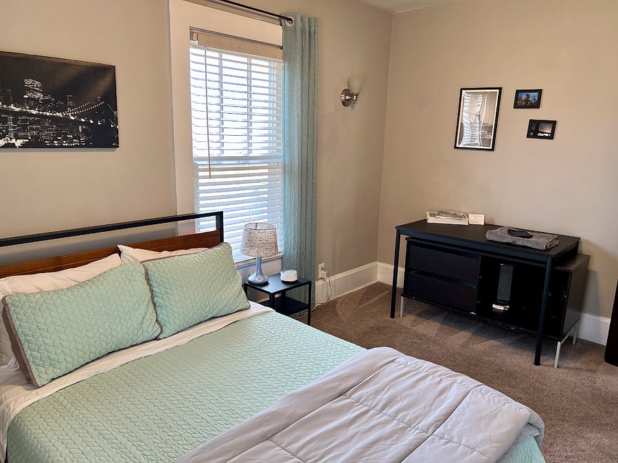 Some storage and a desk, as well as a portable heater and fan.
