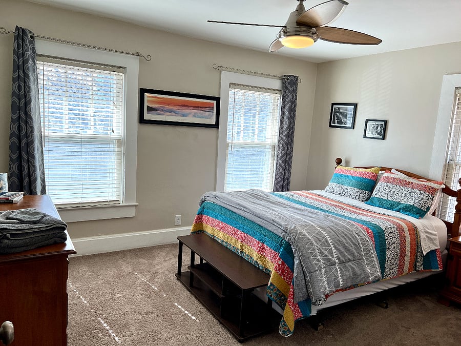 Upstairs. San Francisco room with queen bed and with Serta mattress and 3" foam topper. Room darkening curtains.