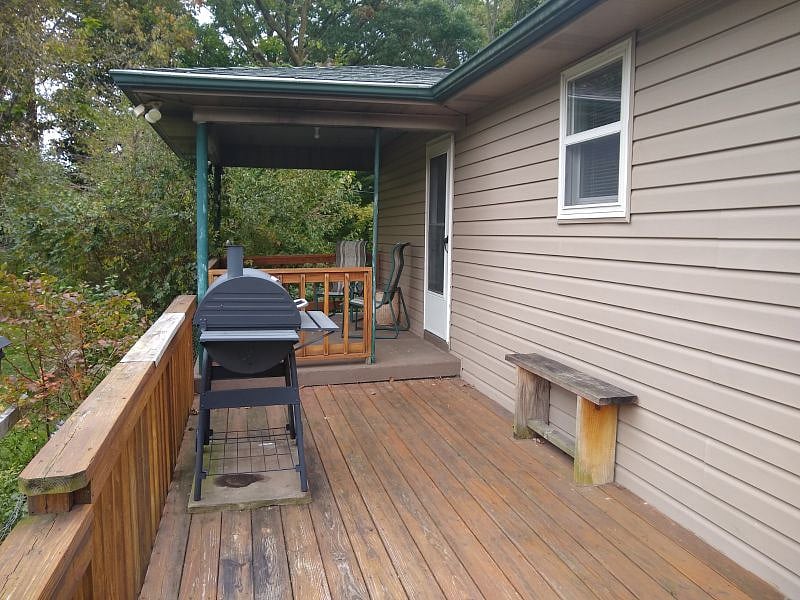 Outside partial deck, chairs, grill