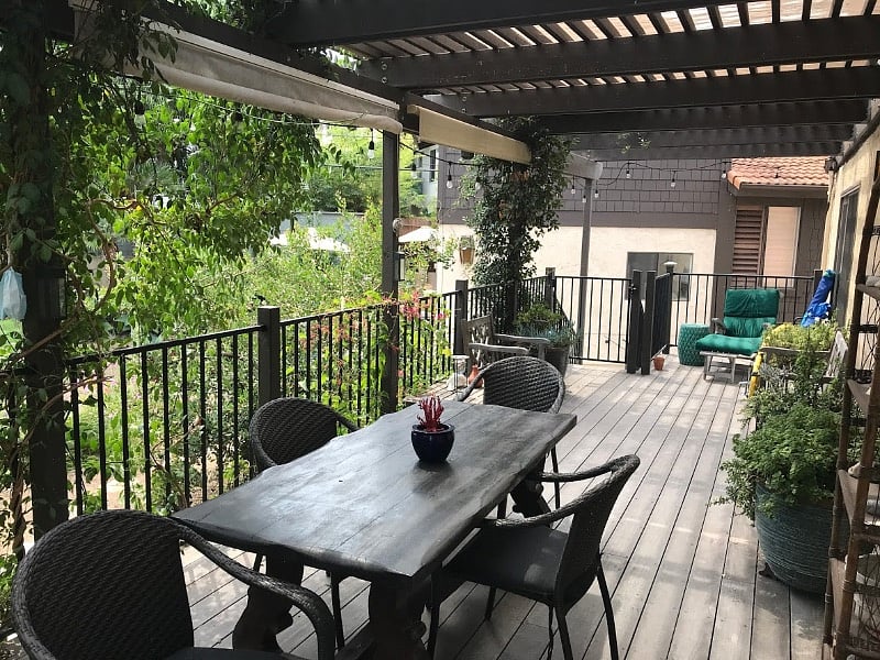 Private front entry deck, with BBQ and dining table set.