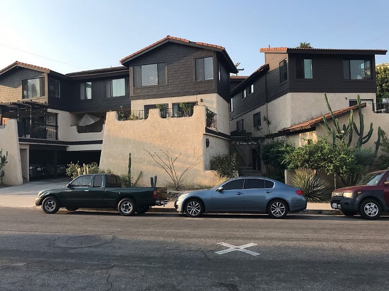 Street view of complex and carport.