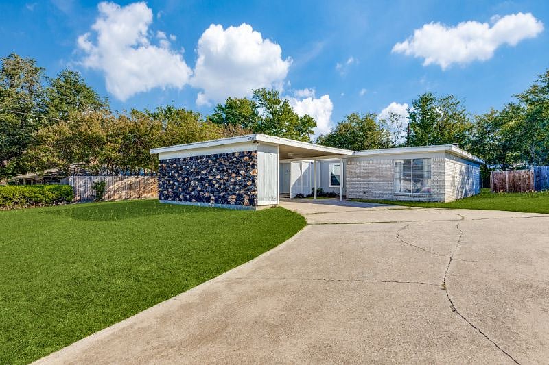 You'll have plenty of space to park your car under the carport or in the driveway.