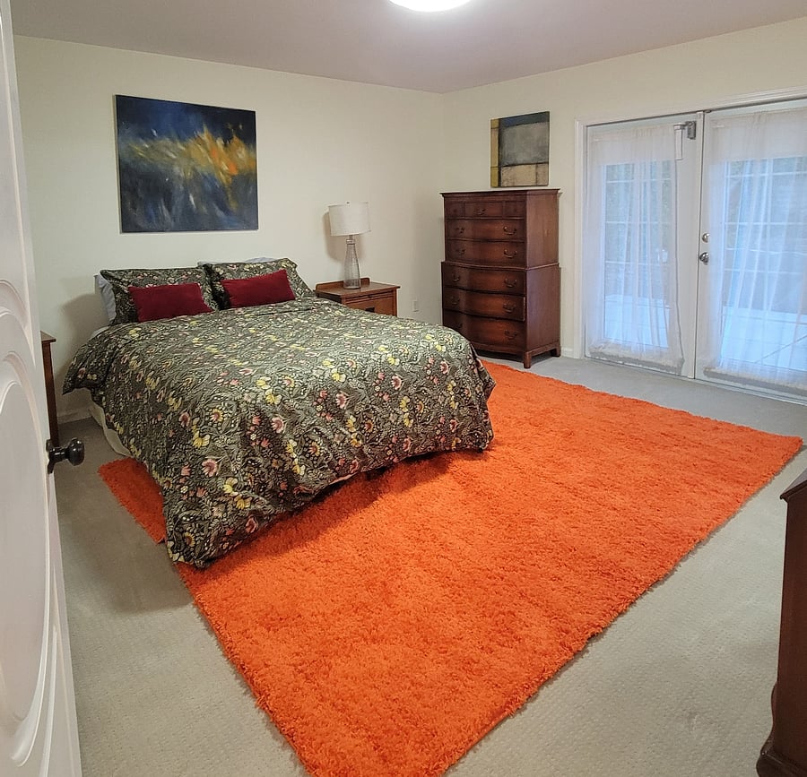 Primary Suite overlooks pool and private garden