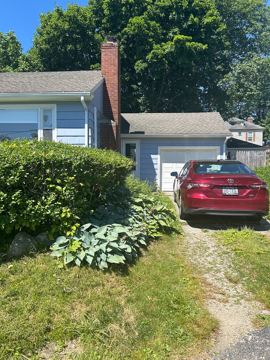 Driveway holds two full size cars and single oversized garage has ample room for a third. Automatic garage opener and protected entry to breezeway outside the kitchen.