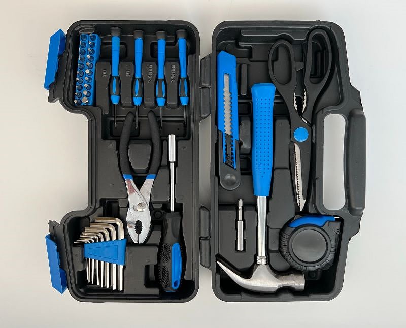 Tool set, Extra batteries, light bulbs and local welcome brochures in the TV stand drawer