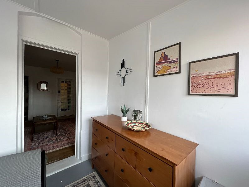 BEDROOM - Large Bedroom Dresser.  Wall art from local New Mexican artists.