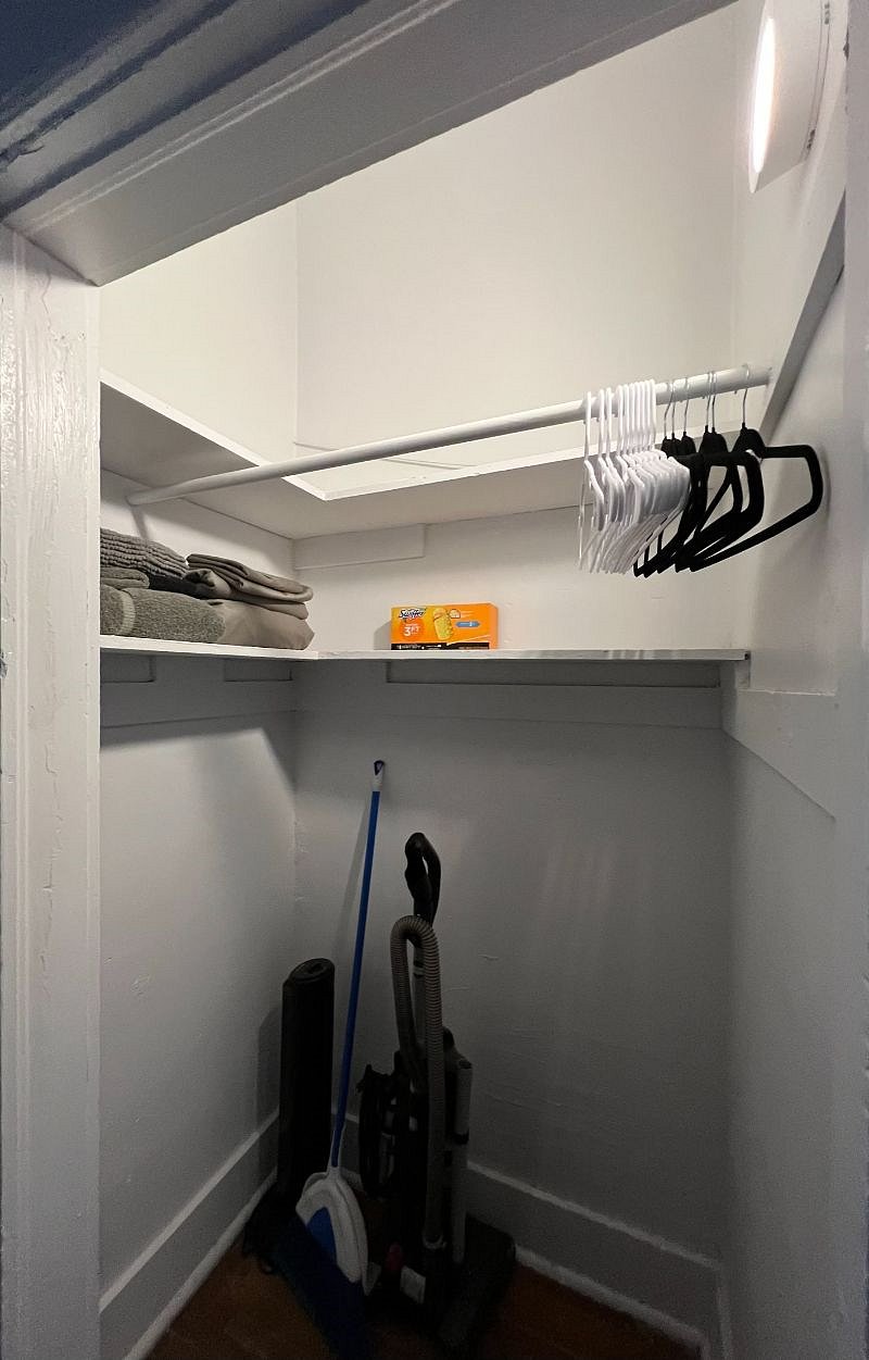 Large closet stocked with vacuum, broom, swiffer, duster, extra set of towel & sheets, plenty of floor space in closet and space to hang clothes