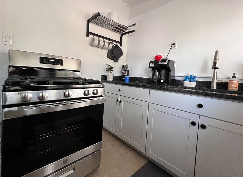 FULL KITCHEN with new appliances - New Oven, New Full size fridge, Microwave, Blender, drip/k cup combo coffee maker, & all the kitchen items you need!
