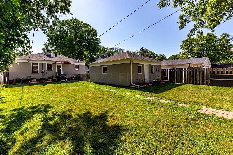 The backyard is large with a fence and additional parking in the alley. Back dood entry with coded lock