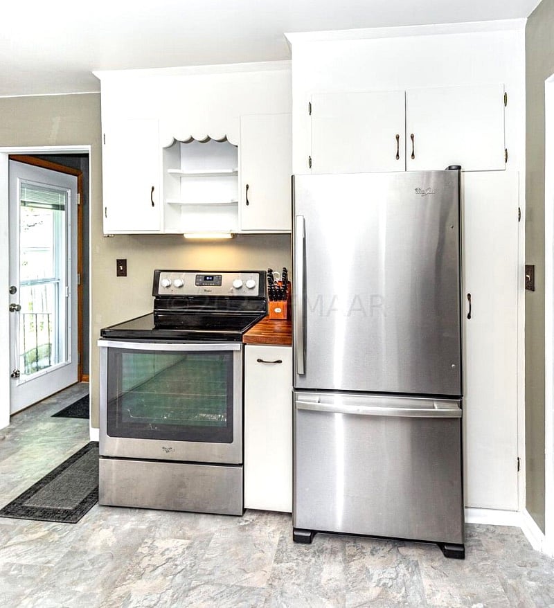 Full size fridge and bottom drawer freezer, a lot of storage with supplies