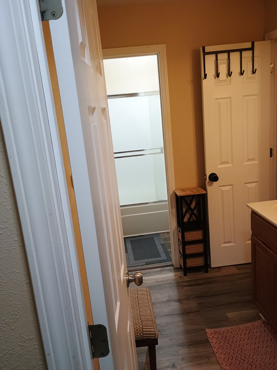 Shared Bath. Direct entry from Bed 3. From Bed 2, you have to step out into hallway.