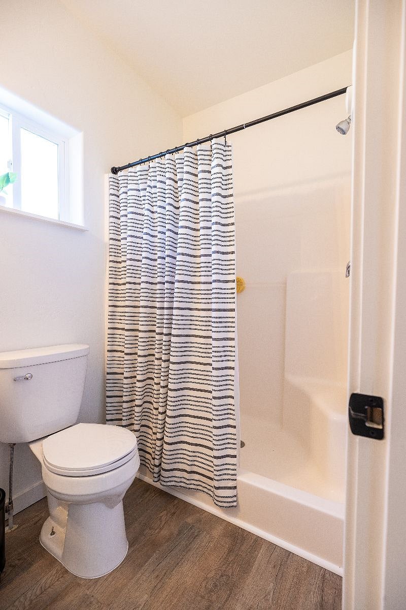 The ensuite master bathroom has a large shower