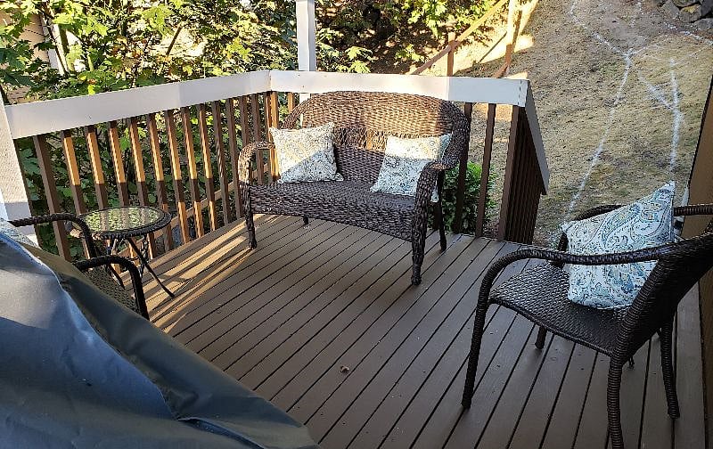 Common side deck with furniture and gas BBQ.
