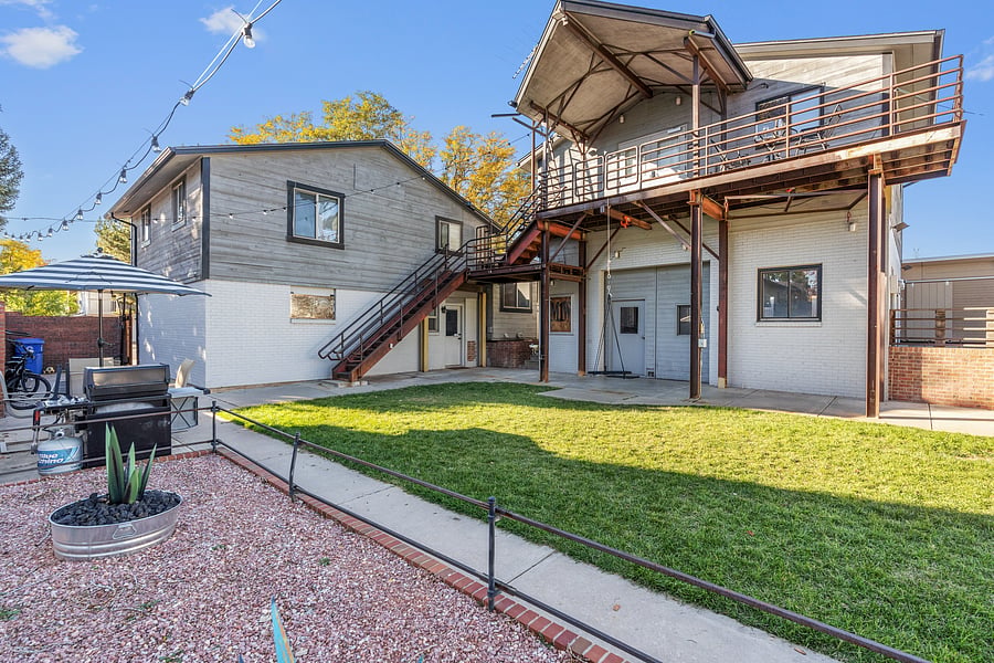 Shows stairs to this upstairs unit and balcony/deck with excellent views.