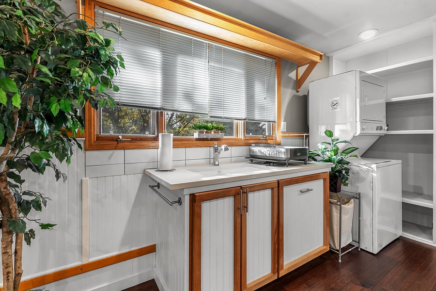 Kitchen with large windows and lots of natural light over sink.