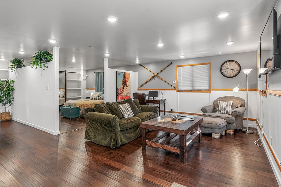 Open floor plan. Dedicated work area with desk and office chair in the background.