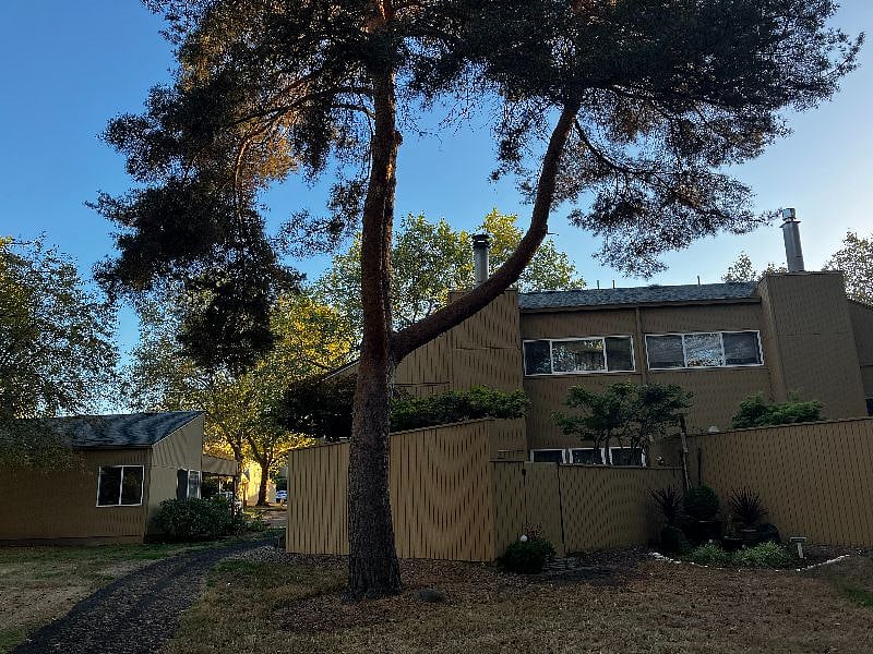 Back of the house opens to the walking trails and is steps away from tennis courts, pool, and playground