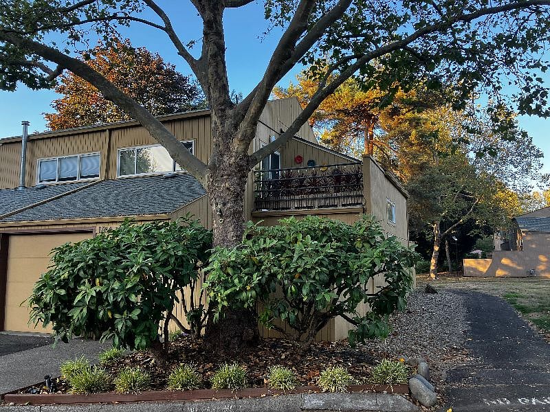Front of the house next to the start of a walking path
