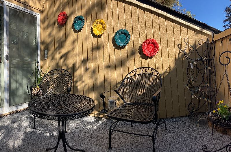 Second-floor courtyard shaded by a tree